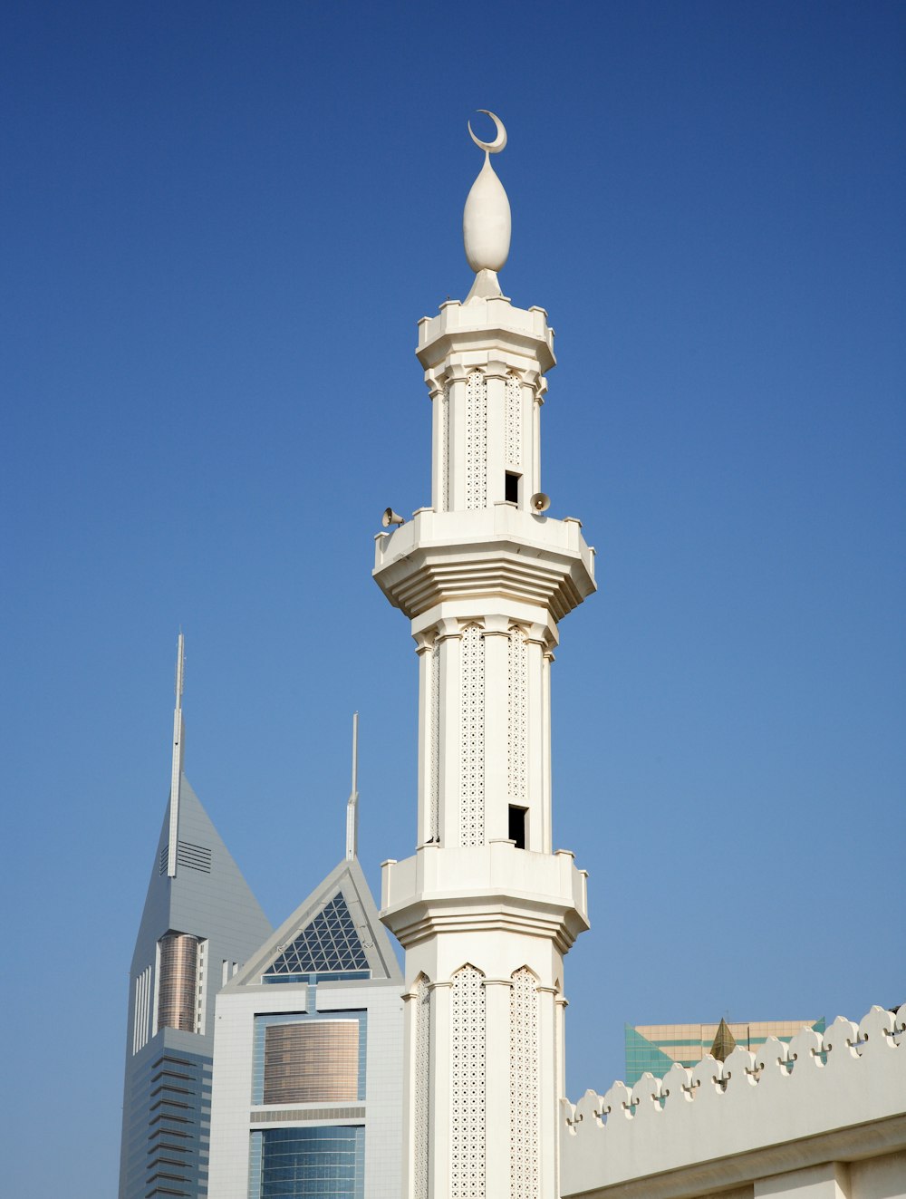 white concrete building under blue sky during daytime