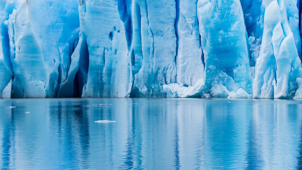 white ice on body of water during daytime