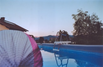A happy family enjoying their perfectly maintained pool on a warm Hill Country afternoon.