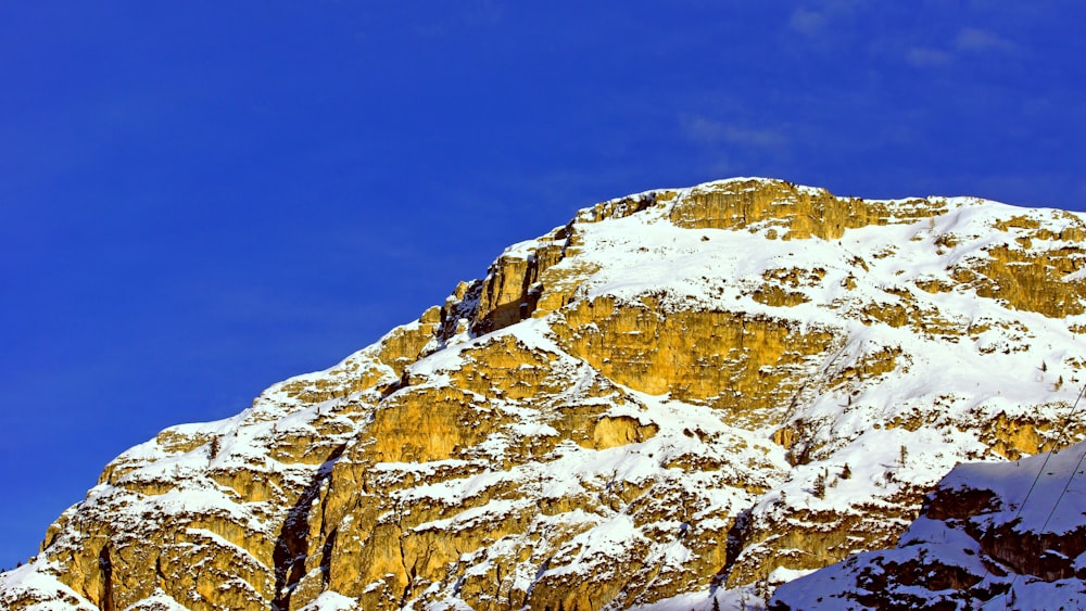 white and brown mountain under blue sky during daytime