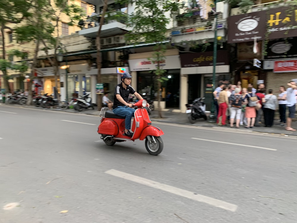 people riding on motorcycle on road during daytime