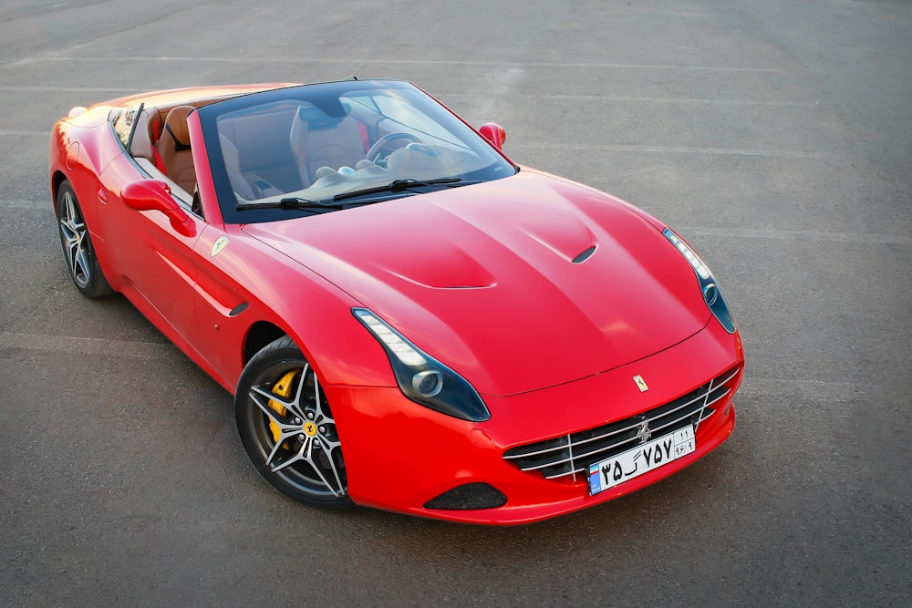 red ferrari 458 italia on road during daytime