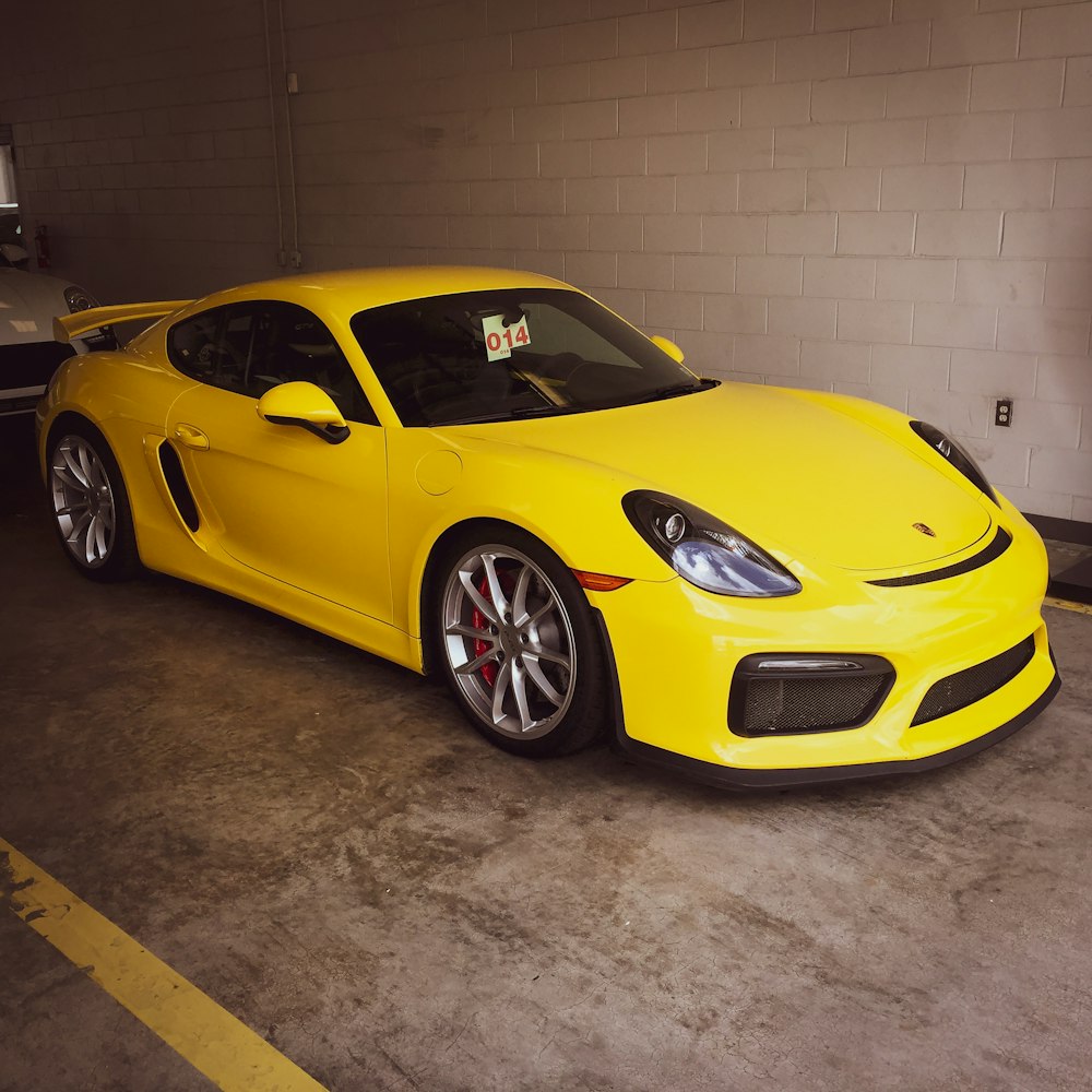yellow ferrari 458 italia parked in garage