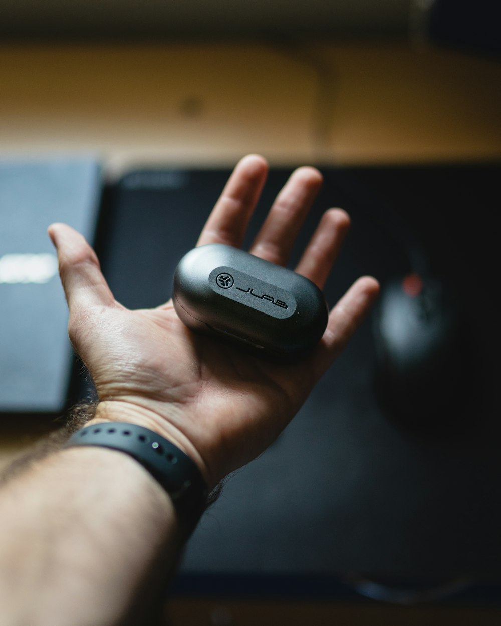 person holding black and gray smart watch