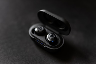 silver and black scissors on black surface