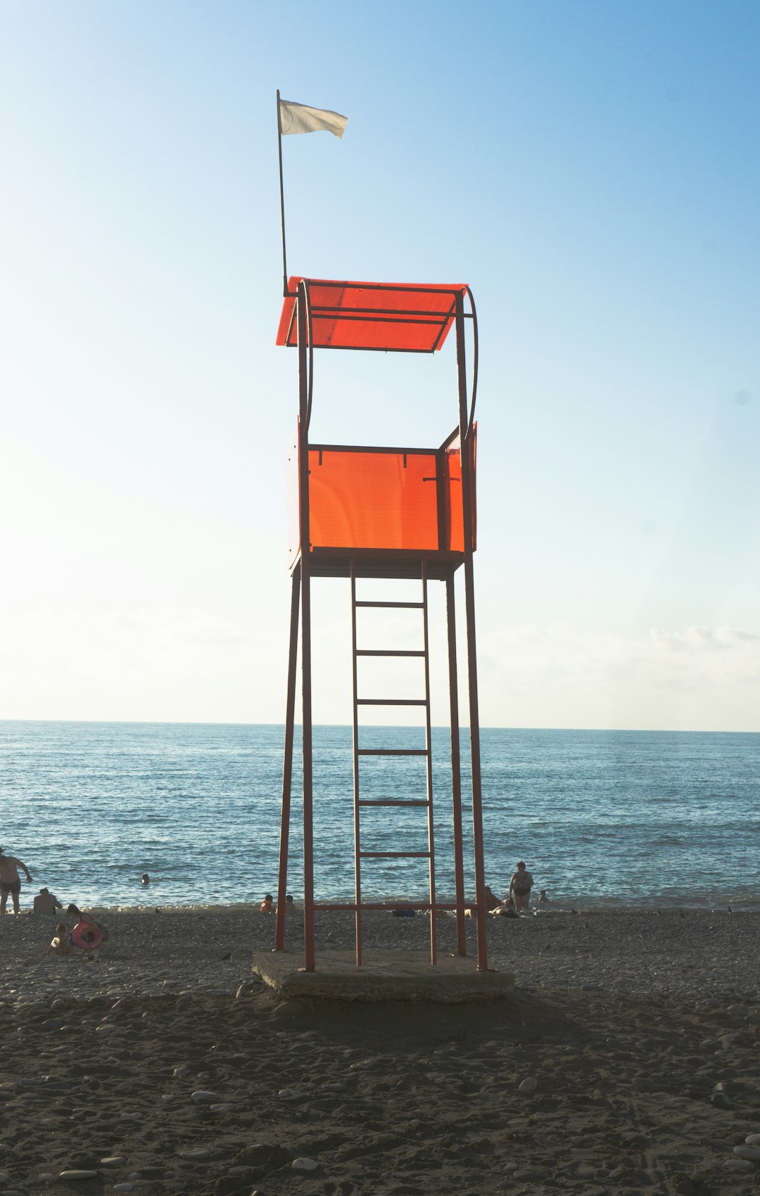 orange and gray lifeguard tower on beach during daytime