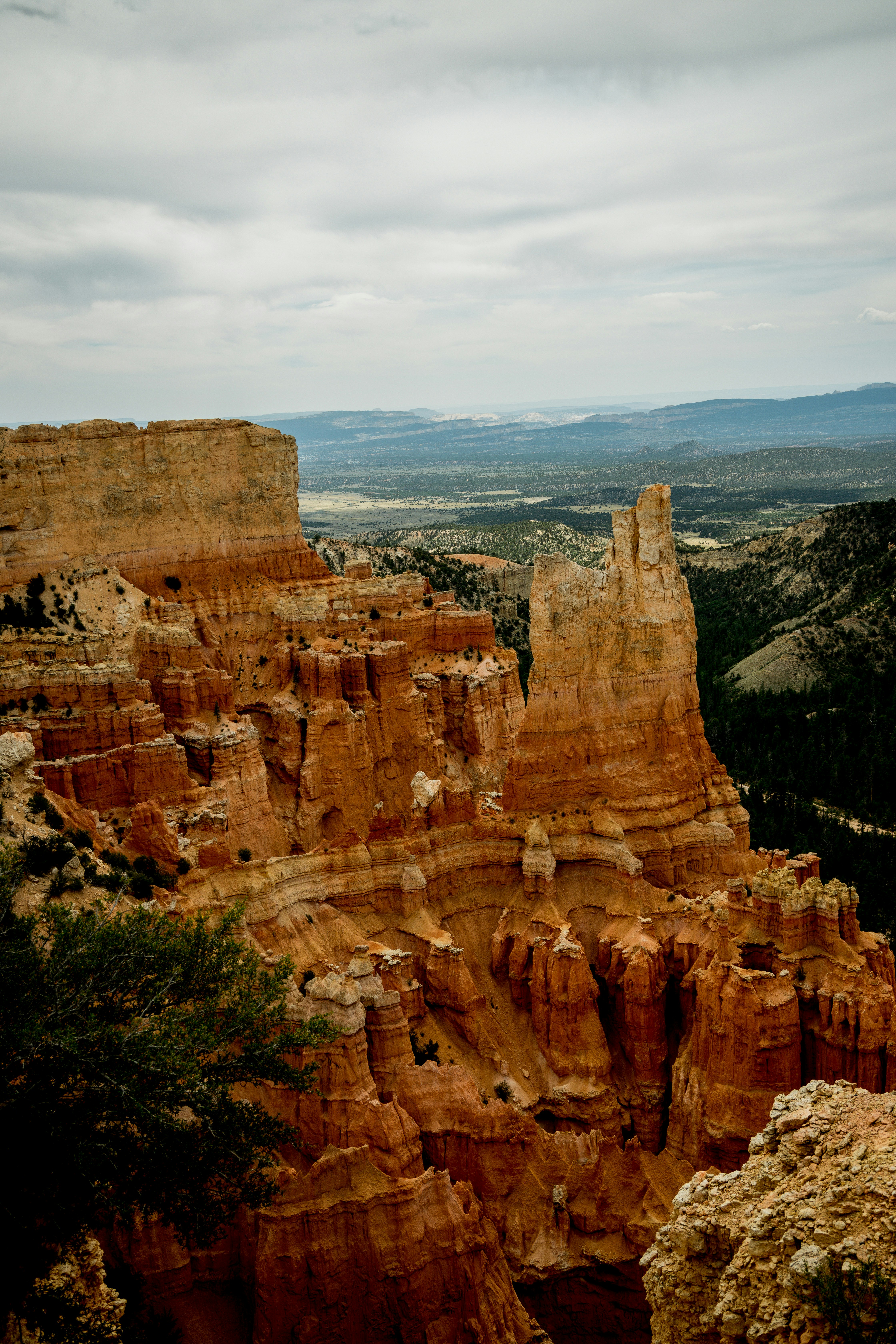 brown rock formation under white sky during daytime