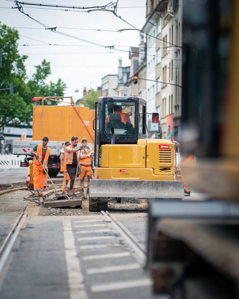 Crew beside an excavator