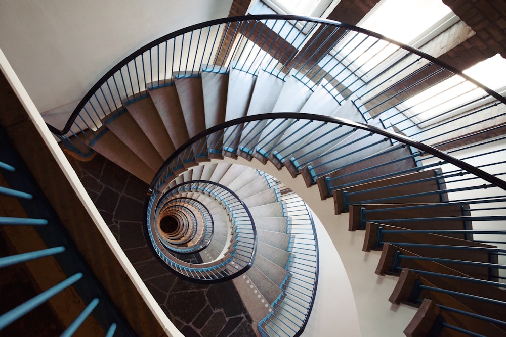 white spiral staircase with gray metal railings