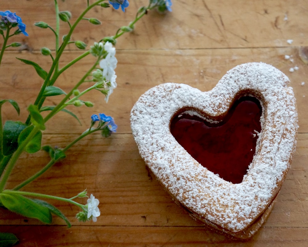 brown and white heart shaped stone on brown wooden surface