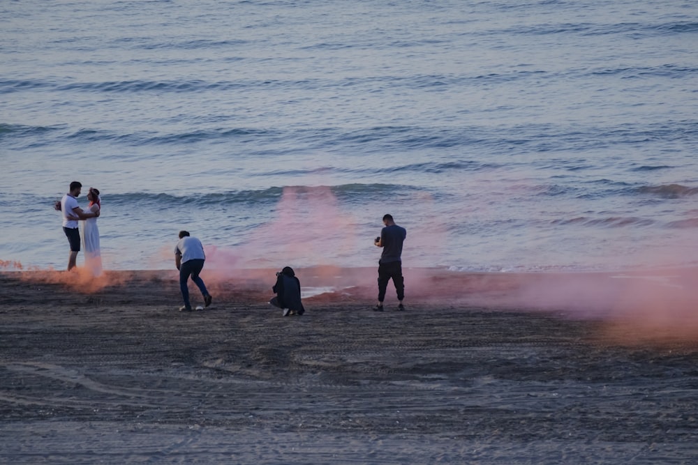 people standing on beach during daytime