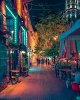 people sitting on brown wooden chairs during nighttime