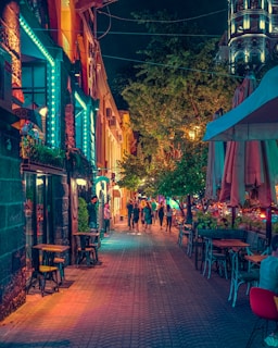 people sitting on brown wooden chairs during nighttime