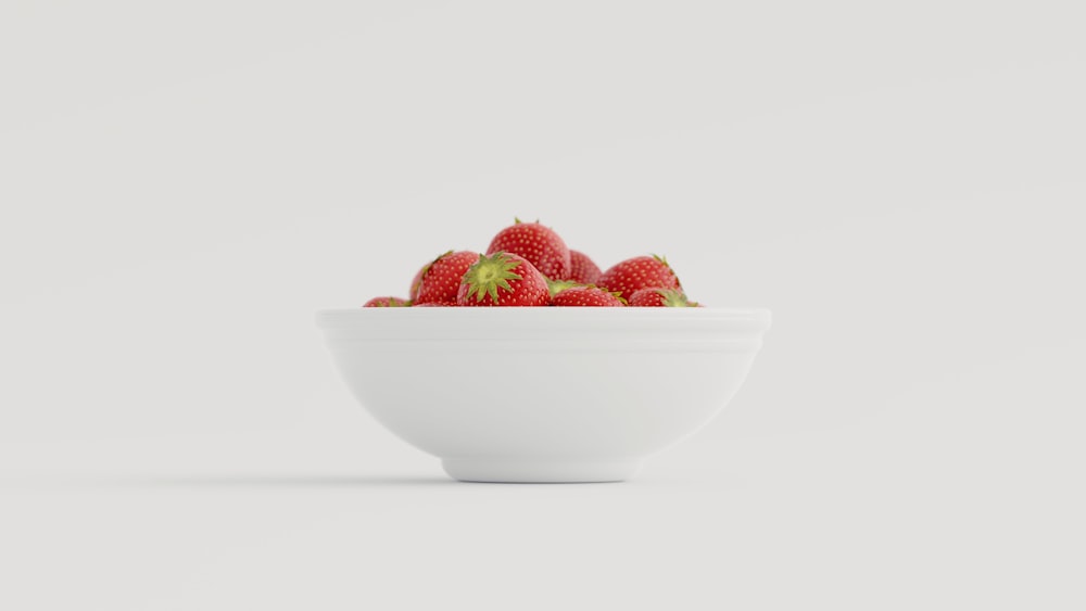 strawberries in white ceramic bowl