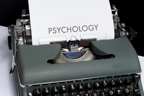 a close up of a typewriter with a paper on it