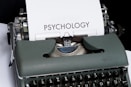 a close up of a typewriter with a paper on it