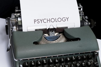 a close up of a typewriter with a paper on it