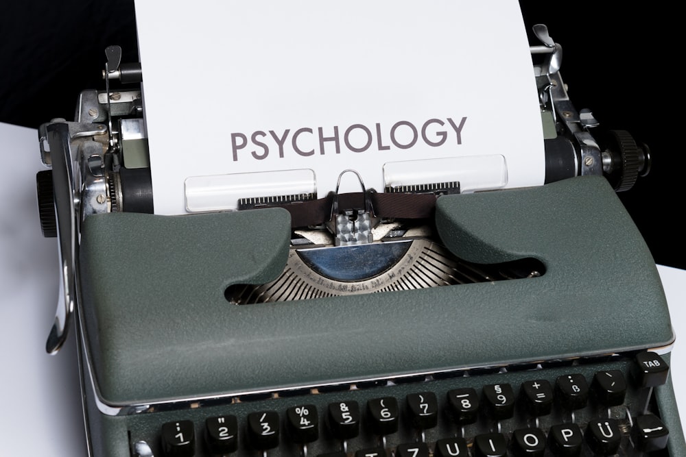 typewriter with paper reading "psychology"