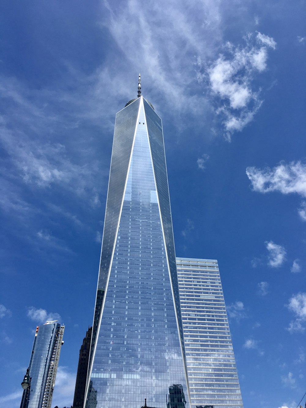 low angle photography of high rise building under blue sky during daytime