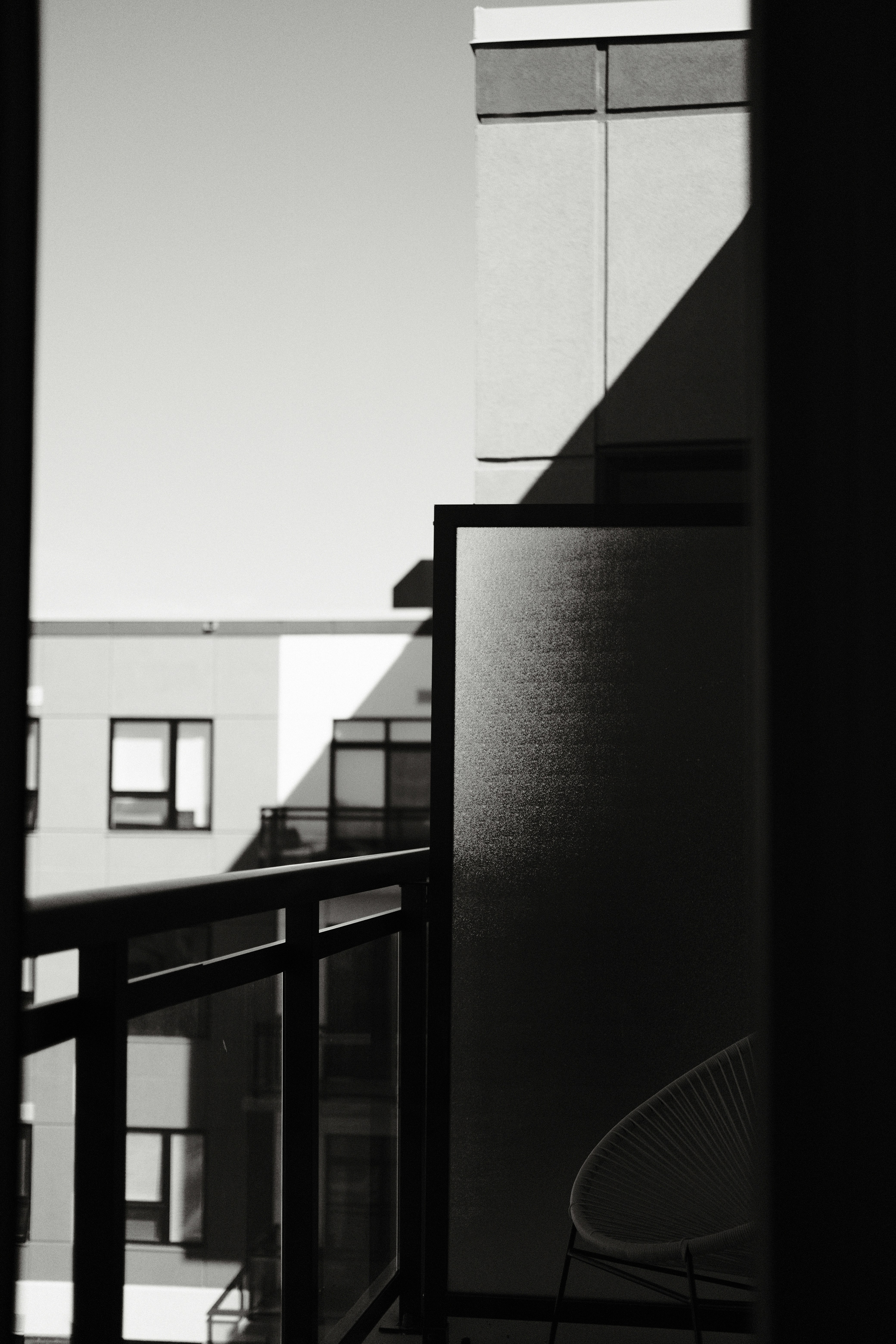 black metal railings near white wall