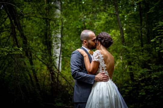 man in black suit kissing woman in white wedding dress in Johannesburg North South Africa