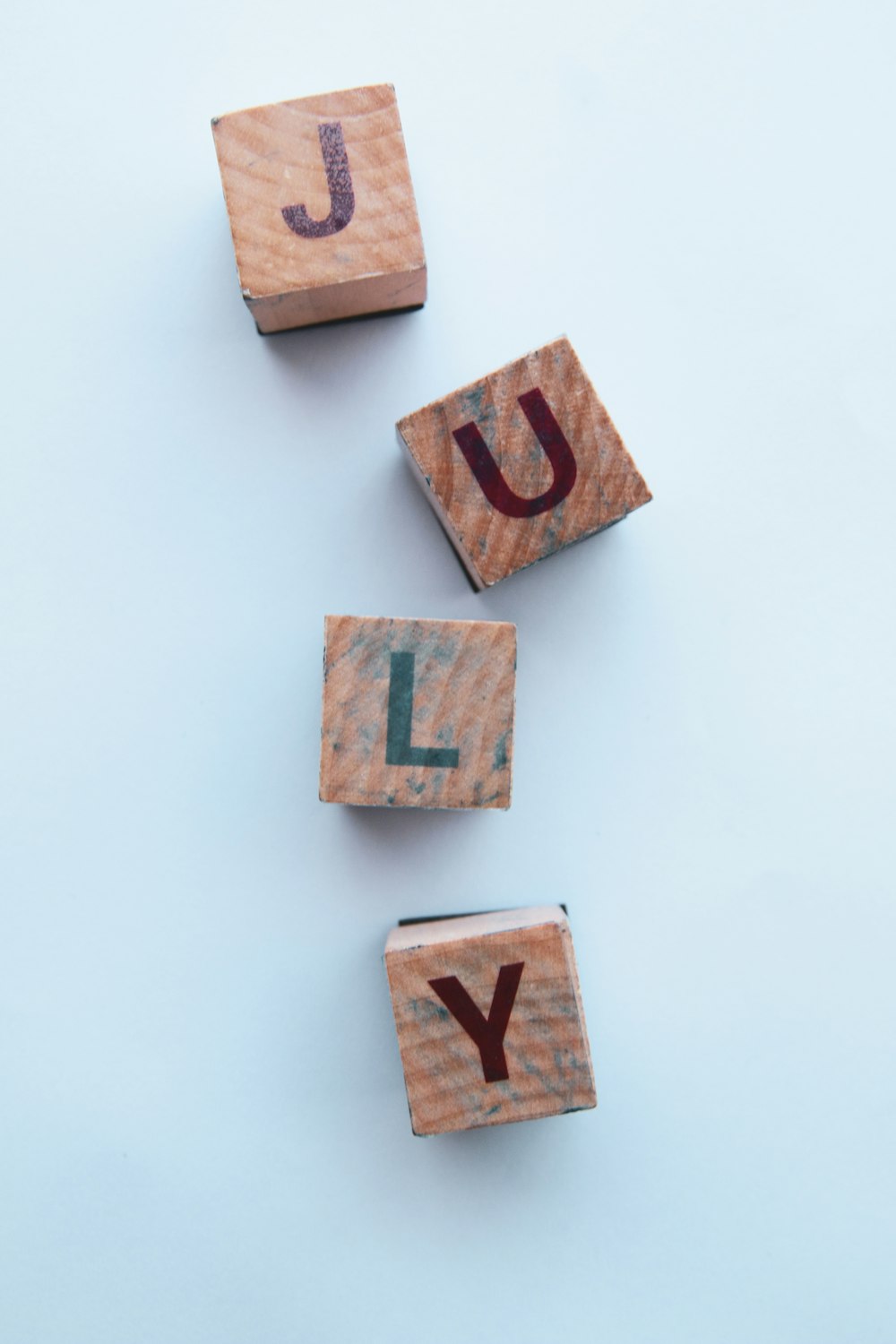 brown and white letter x wall decor