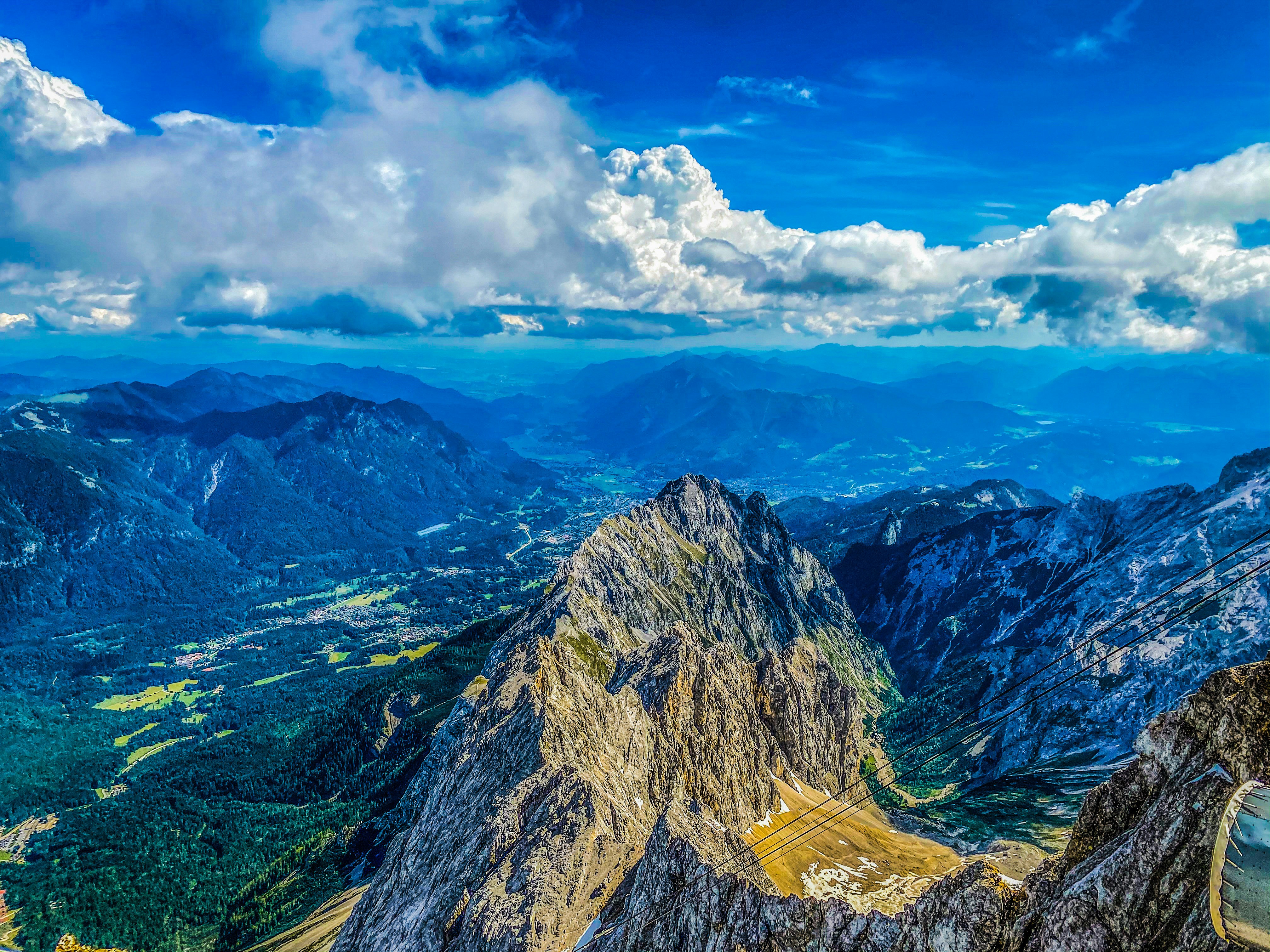 green and brown mountains under blue sky and white clouds during daytime
