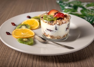 ice cream with sliced lemon on white ceramic plate