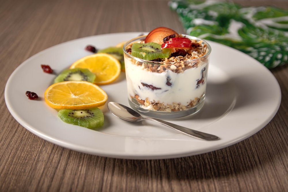 ice cream with sliced lemon on white ceramic plate