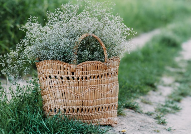 brown woven basket on green grass field