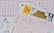 Three lottery tickets are displayed, including Eurojackpot and Super 6. Various numbers are marked on the tickets, with some crossed out and others checked. The Eurojackpot ticket is partially visible with the logo prominently displayed, and a ticket number is visible on one of the tickets.