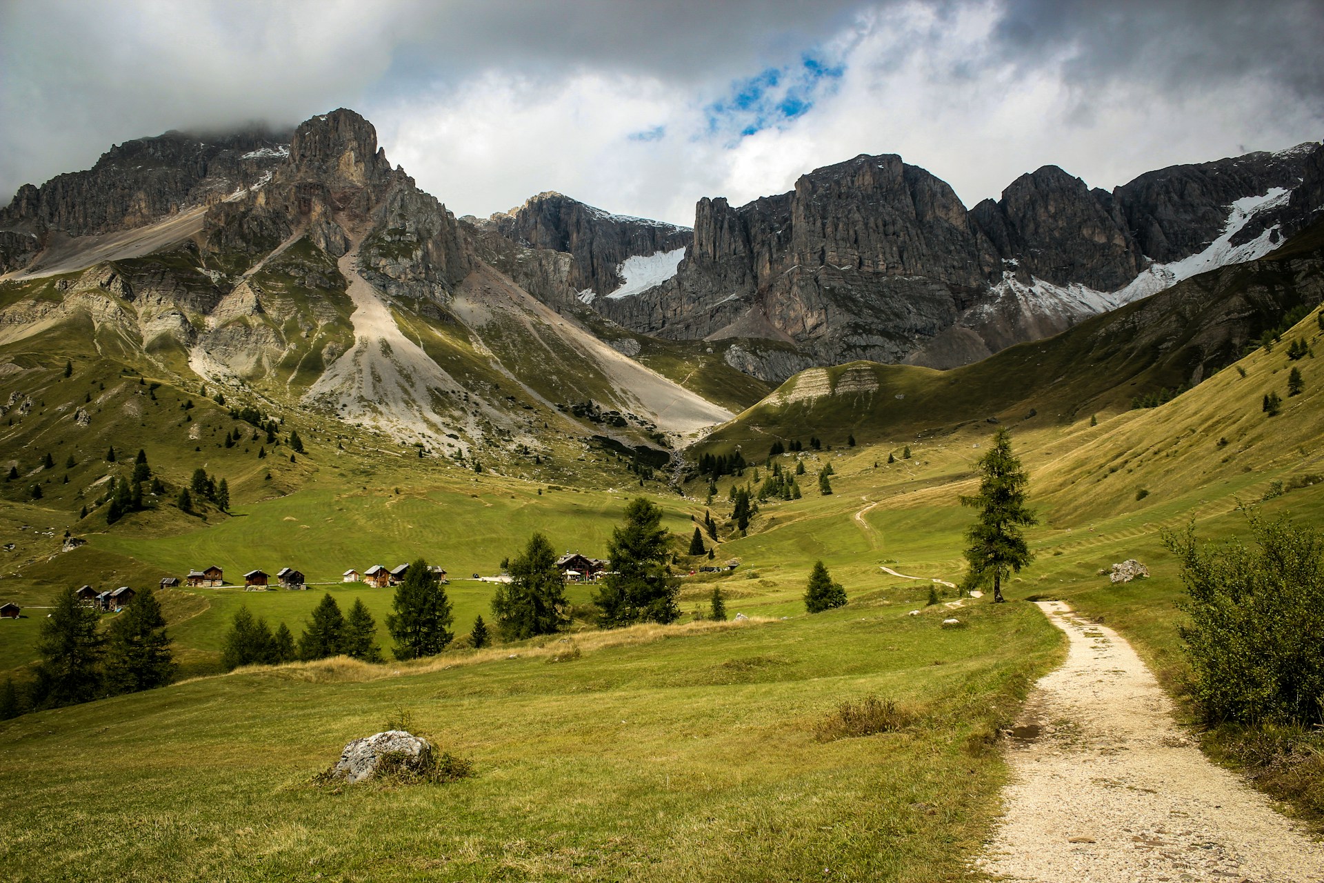 green grass field near mountain during daytime