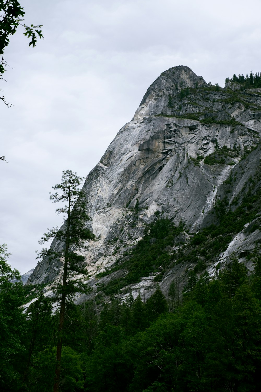 gray rocky mountain under white cloudy sky during daytime