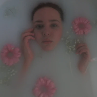 A serene ice bath scene with a member immersed, surrounded by tropical plants and shadows.