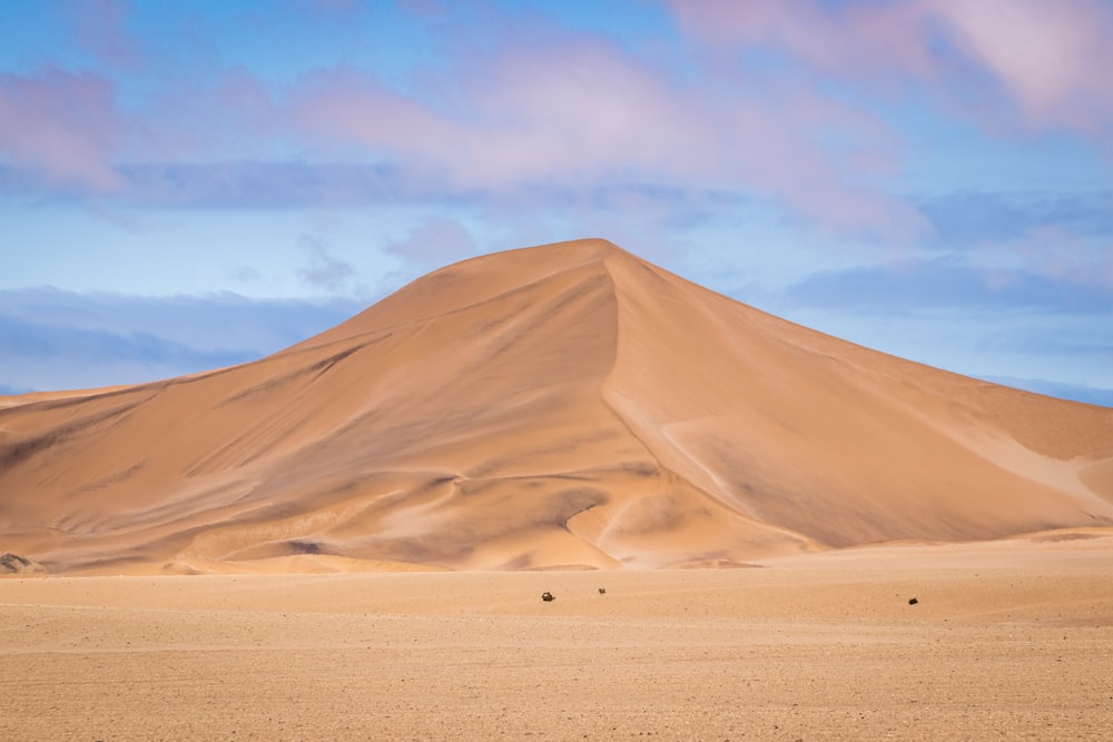 brown sand under blue sky during daytime