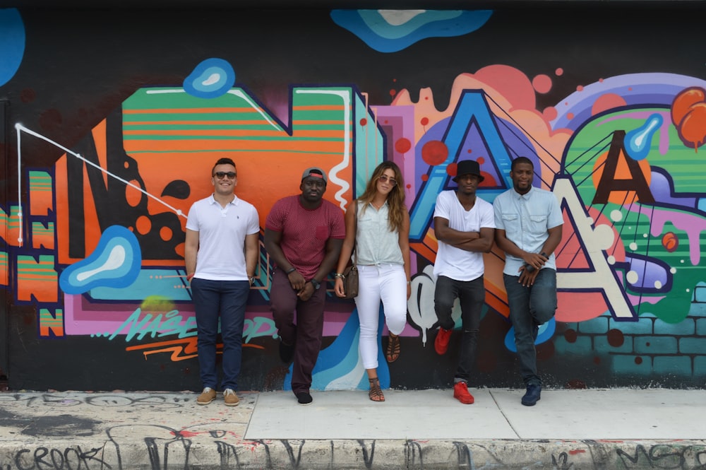 group of people standing on white and brown floor tiles