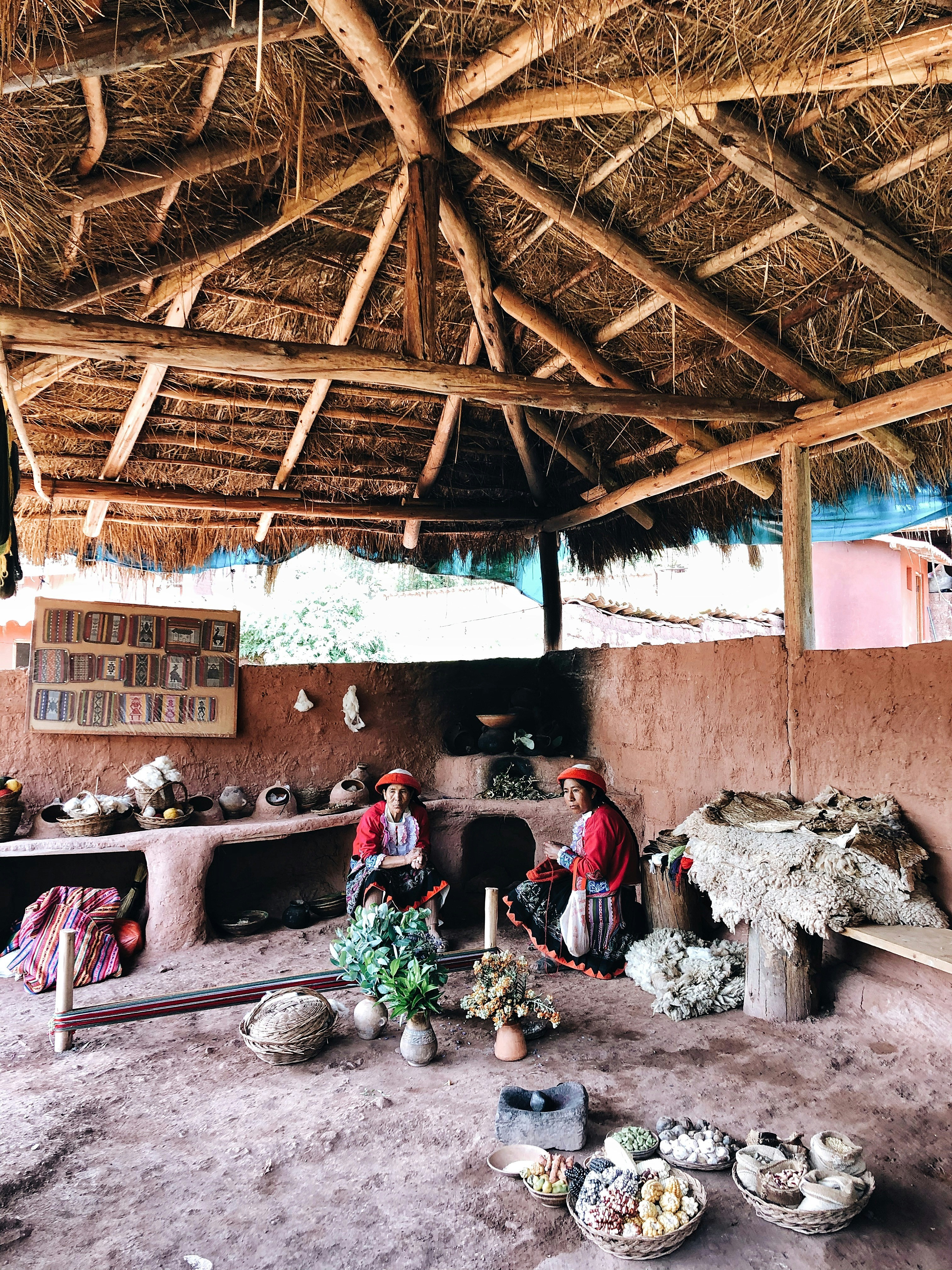 people sitting on brown wooden chairs