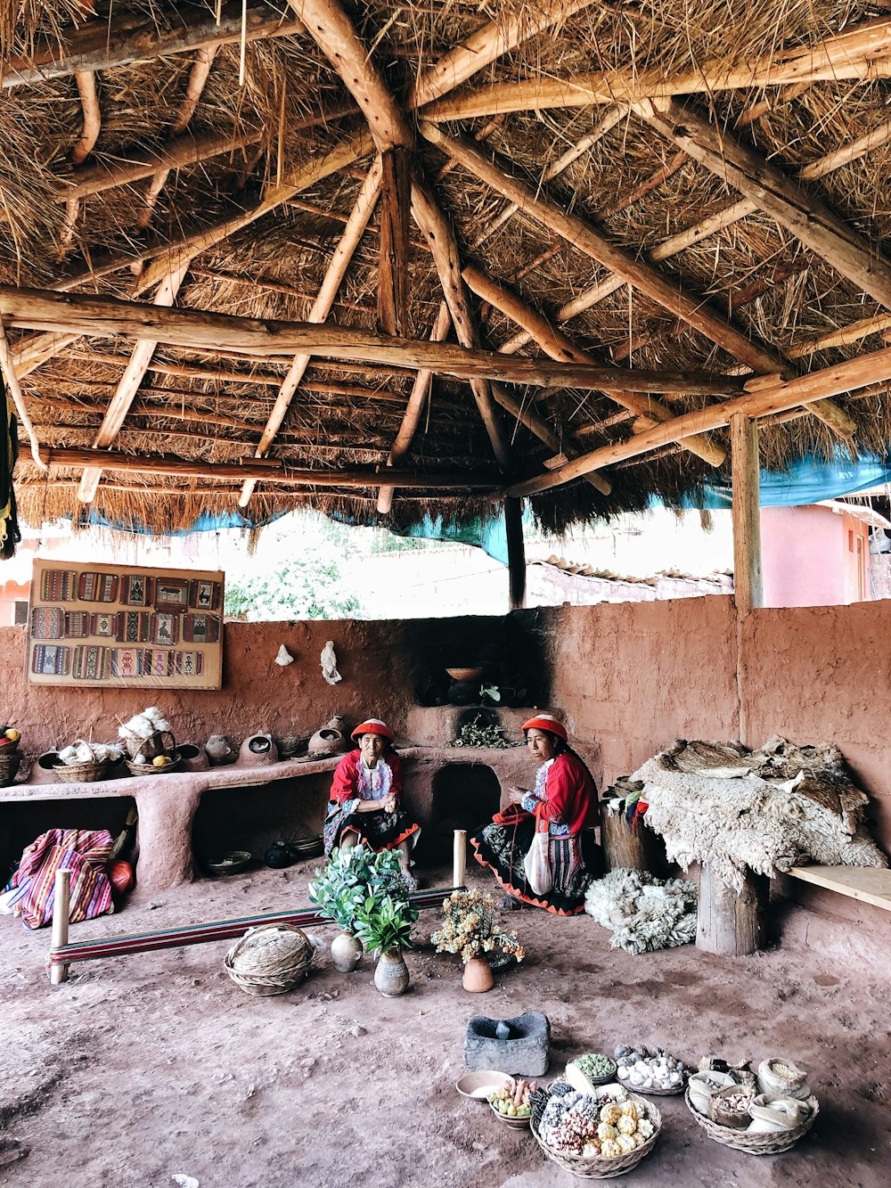 people sitting on brown wooden chairs