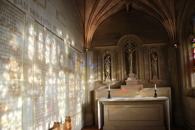 A serene chapel interior bathed in soft white and gold light, with gentle purple accents highlighting the altar.