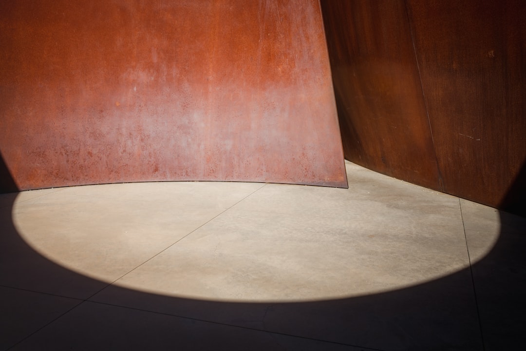 brown wooden board on white floor tiles