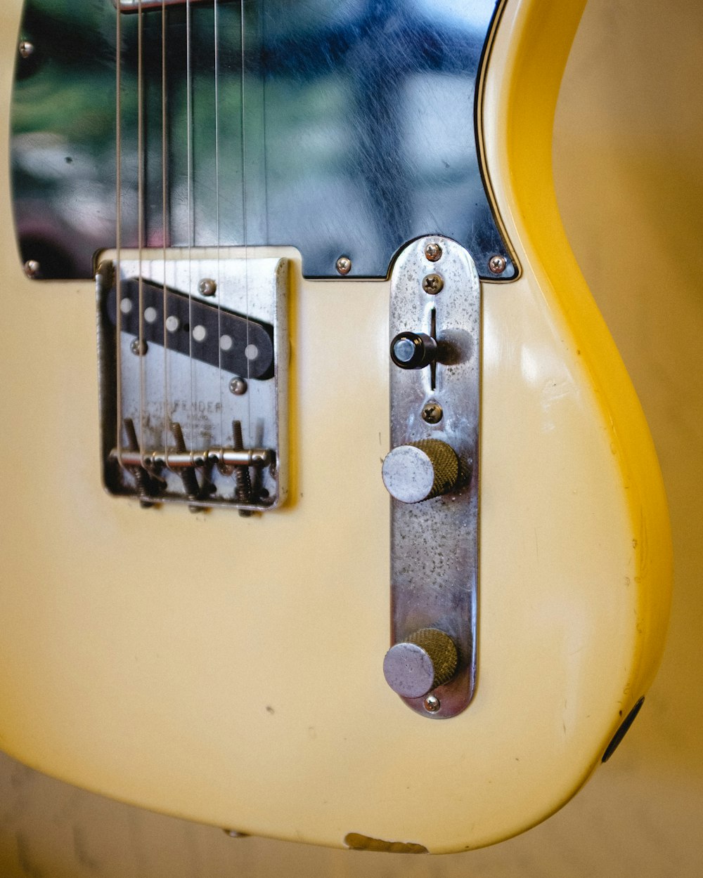 yellow and black electric guitar