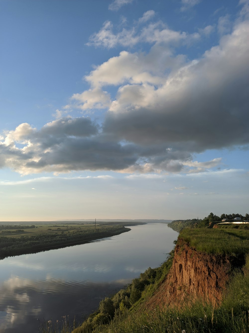 body of water under cloudy sky during daytime