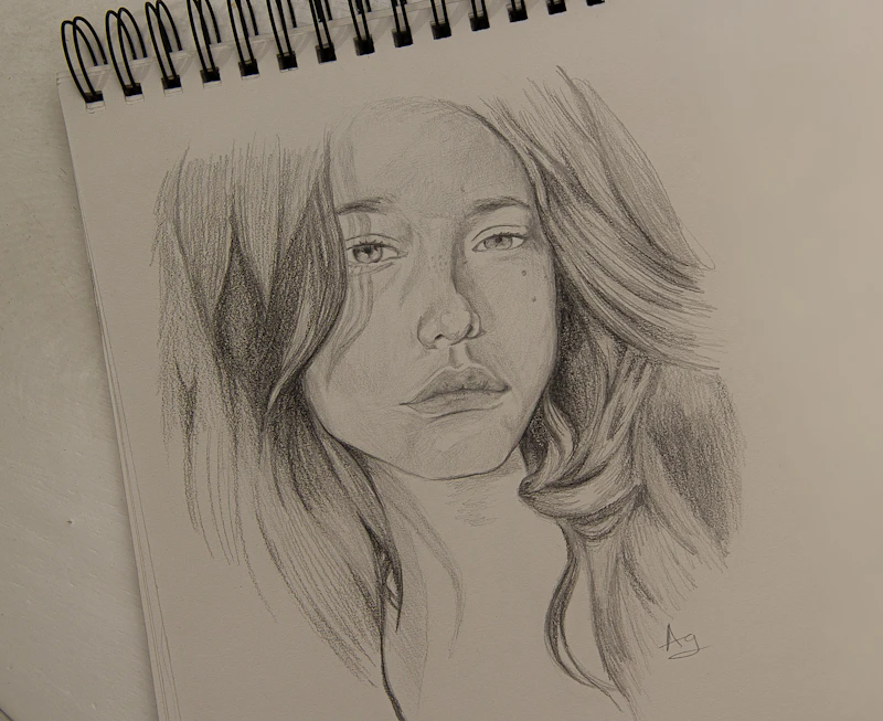 A graphite figure drawing on paper