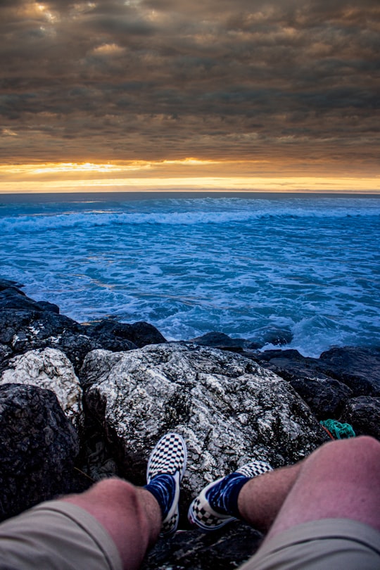 rocky shore with rocks during sunset in Mimizan Plage France