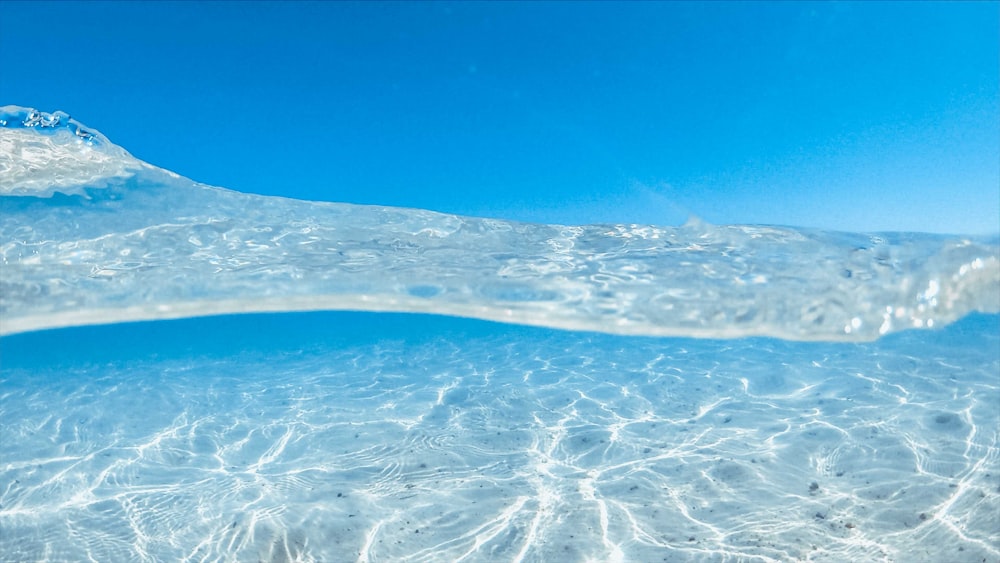 white sand on blue water