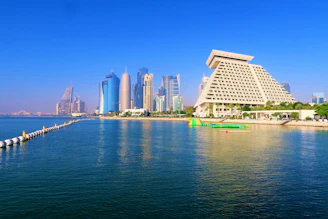 white concrete building near body of water during daytime