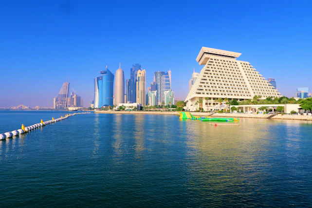 white concrete building near body of water during daytime
