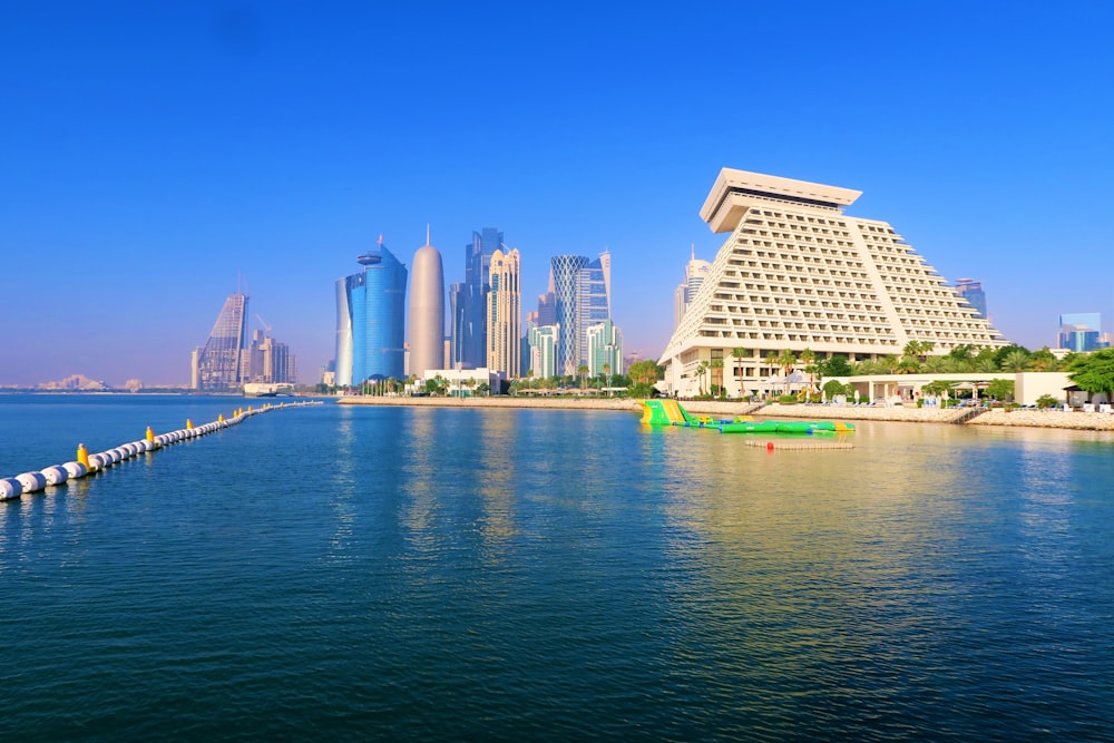 white concrete building near body of water during daytime