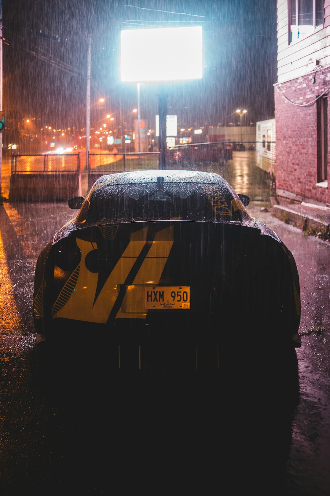 black car on road during night time