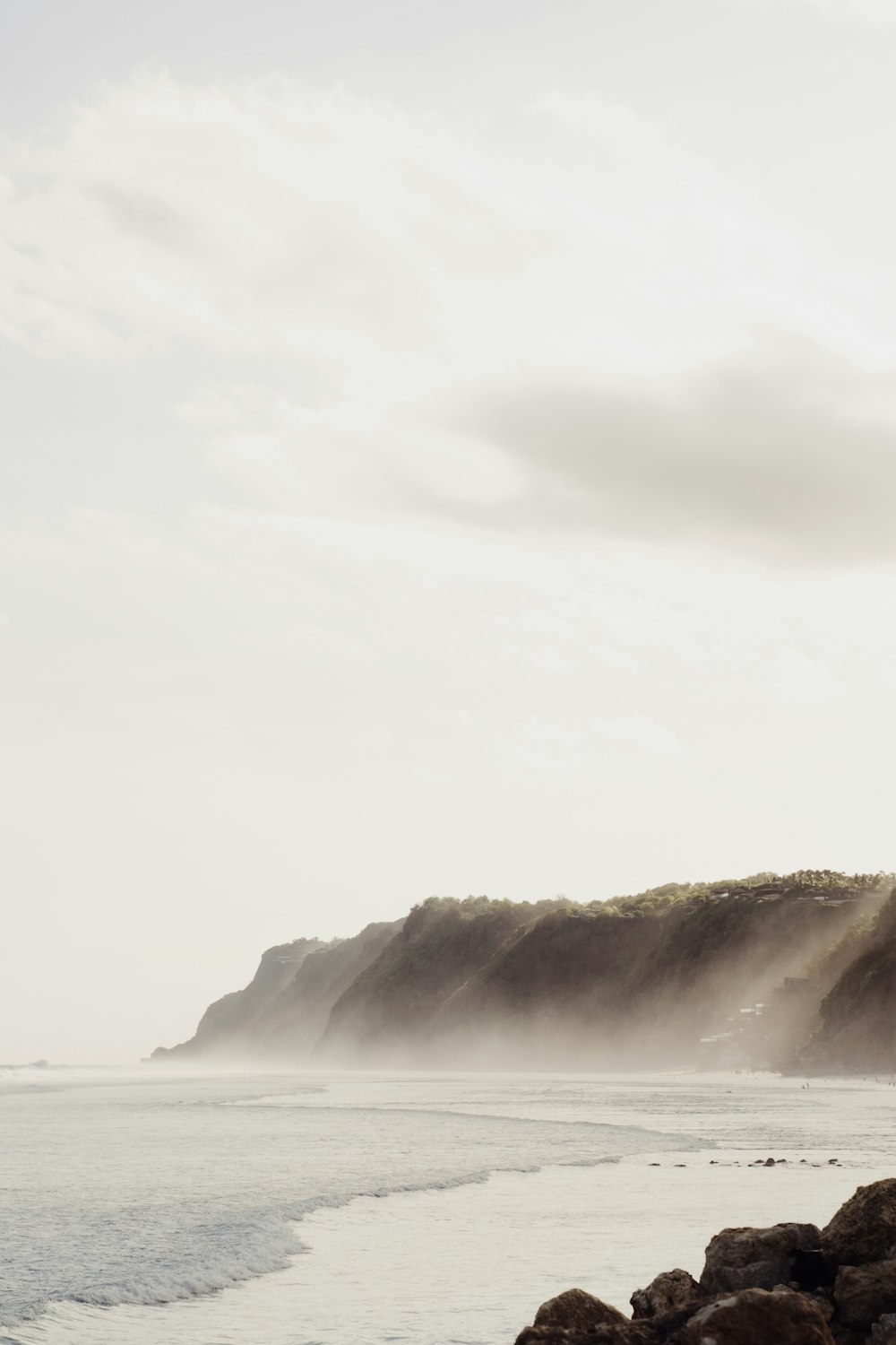 ocean waves crashing on shore during daytime